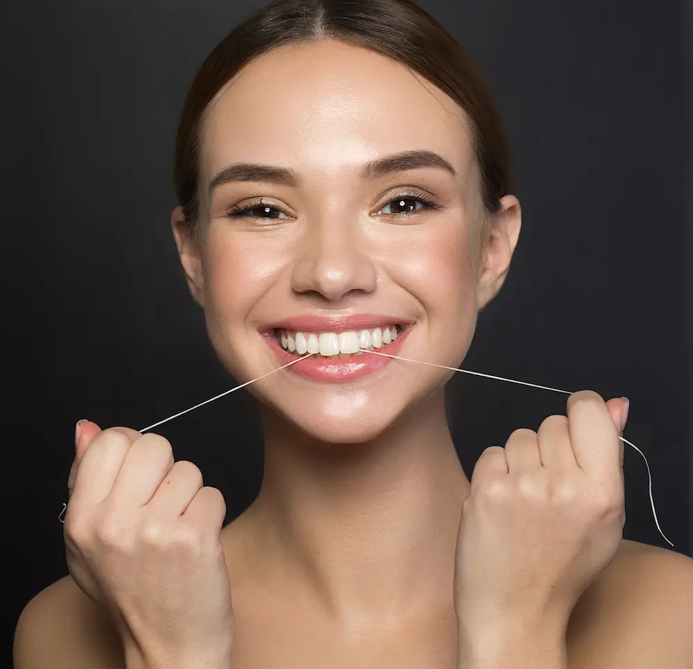 girl flossing